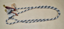 Loop rein: Dark grey, cream and tan in the  "snake skin" pattern.